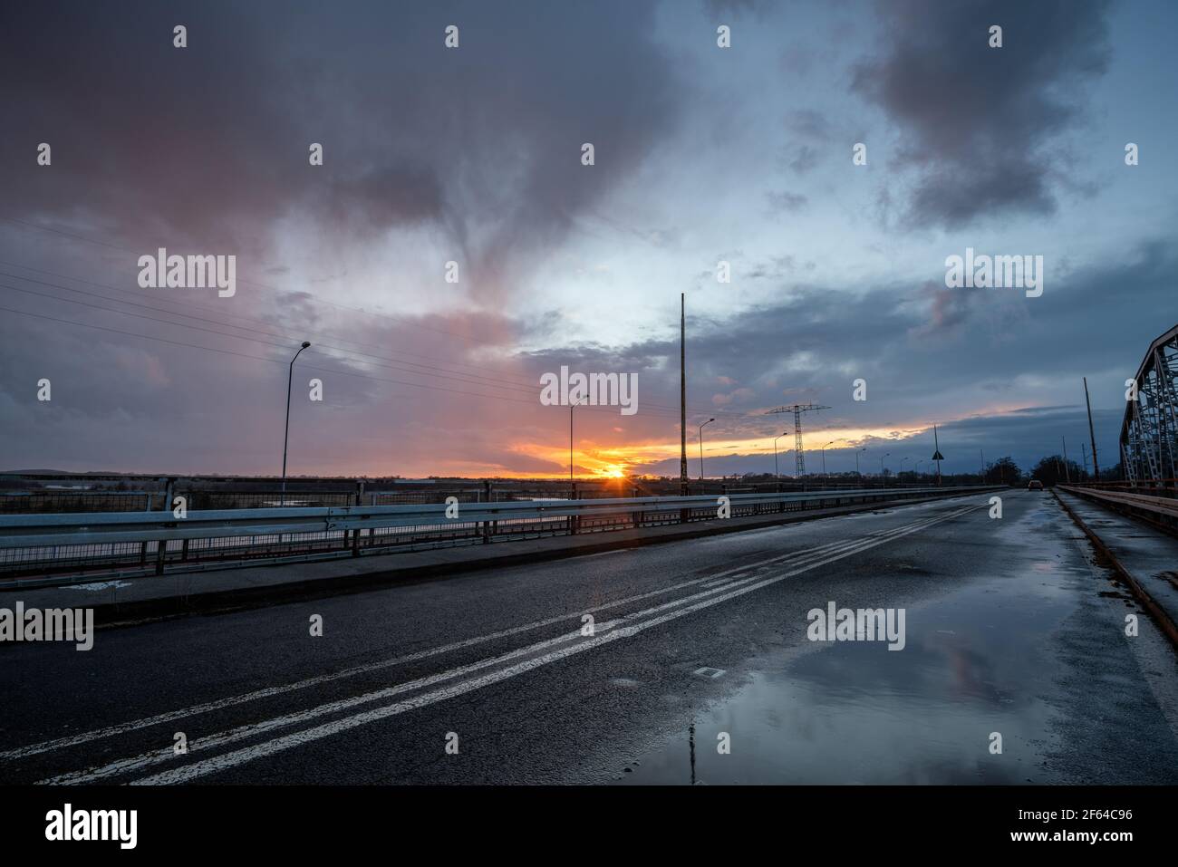 Stormy sunset over the road bridge Stock Photo