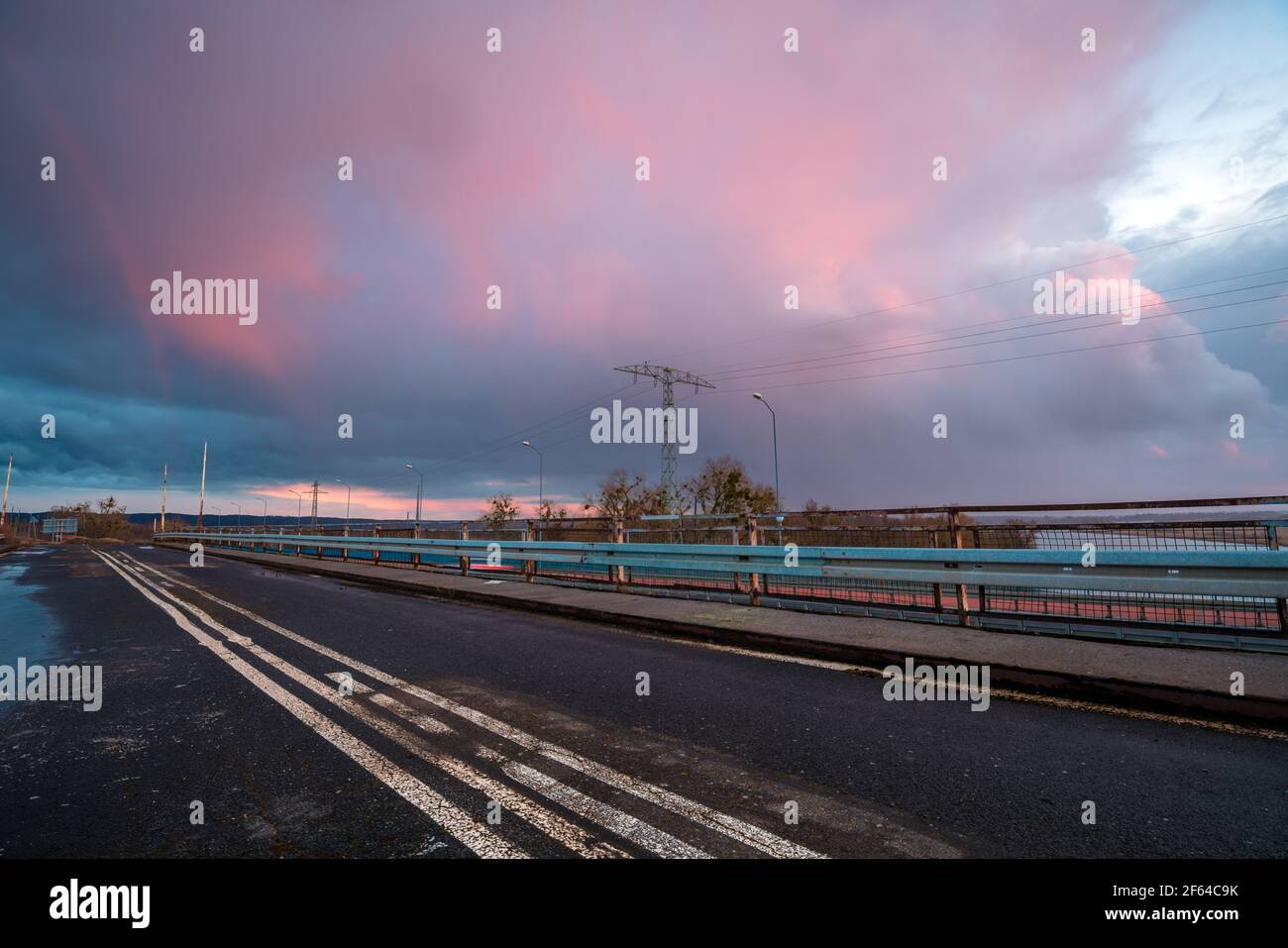 Stormy sunset over the road bridge Stock Photo