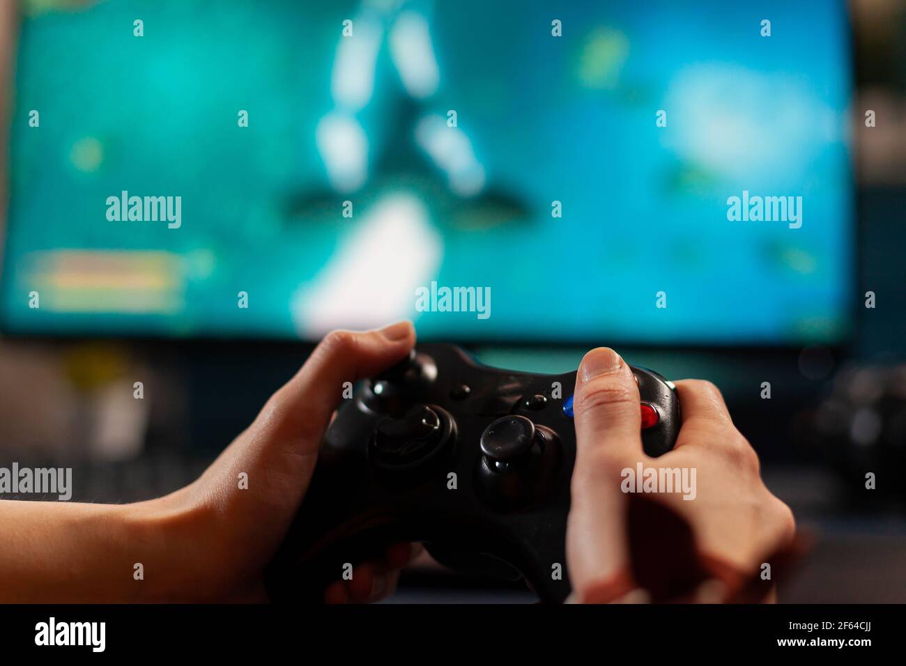 Free Photo  Person playing video games with controller on computer. player  using joystick and wearing headphones to play online game on monitor.  modern man using gaming equipment to have fun.