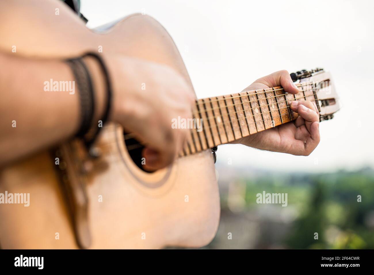 Mans hand playing acoustic guitar hi-res stock photography and images ...