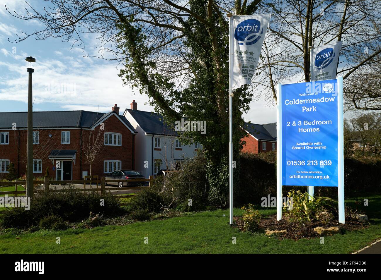 Hoarding advertising new 2 and 3 bedroom homes for sale on the Coldermeadow Park housing estate, Corby, England, March 2021. Stock Photo