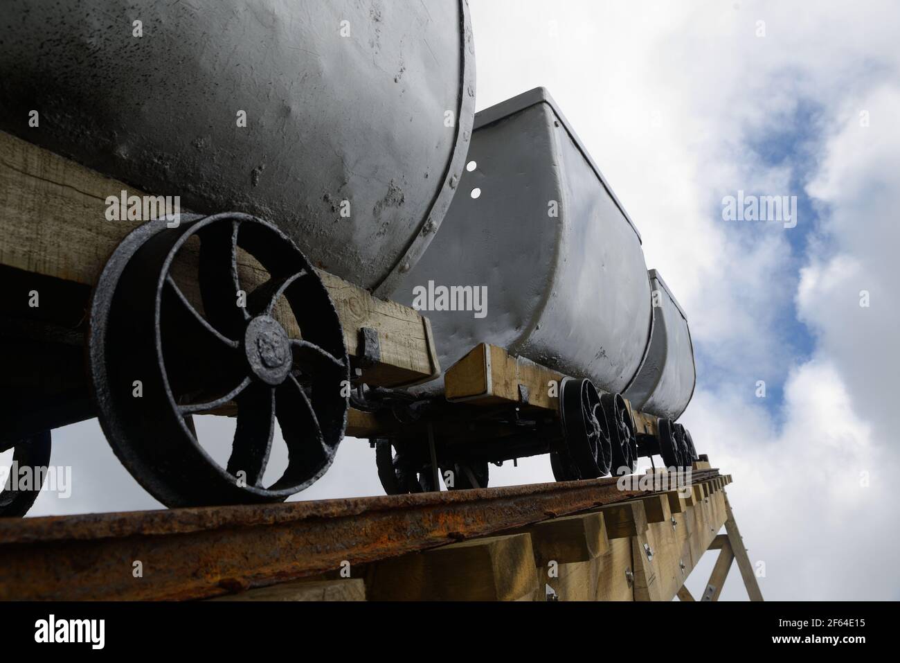 A coal mining memorial at Dobson in New Zealand features vintage coal wagons from an underground mine. Stock Photo