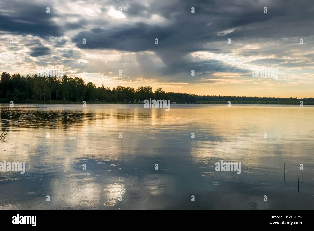 Sunset sky with rain cloud on the lake Stock Photo - Alamy
