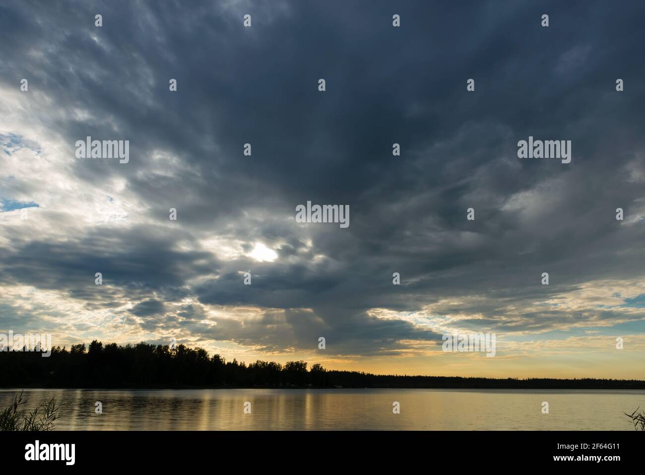 Sunset sky with rain cloud on the lake Stock Photo - Alamy
