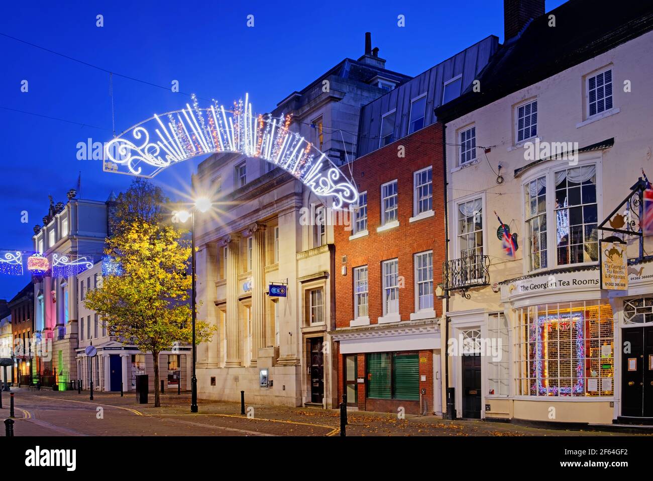 UK, South Yorkshire, Doncaster, Mansion House and High Street buildings with Christmas Illuminations. Stock Photo