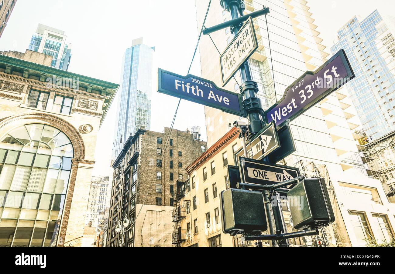 Street sign of Fifth Ave and West 33rd St in New York City - Urban concept and road direction in Manhattan downtown - American world famous capital Stock Photo