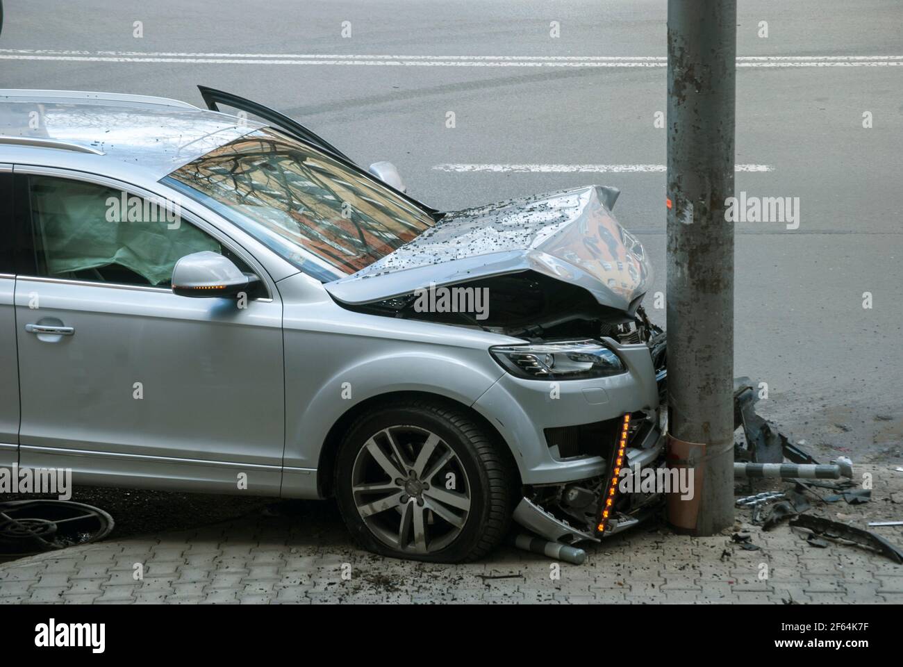 Crashed and smashed car in road accident closeup Stock Photo