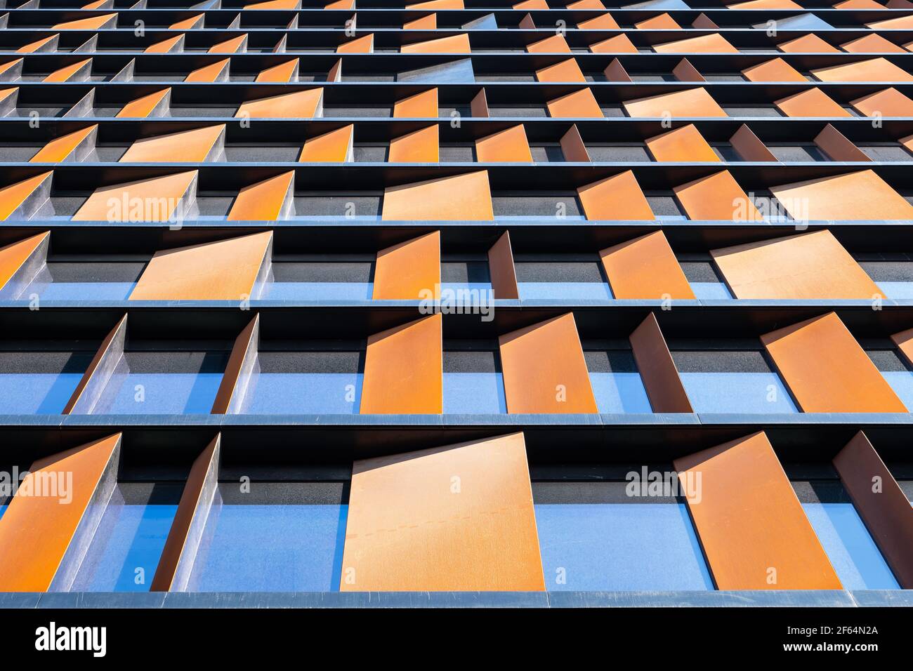 Abstract architecture of modern office building, contemporary facade with corten steel and black Liberta rainscreen panels by Ruukki, Brama Miasta Łod Stock Photo