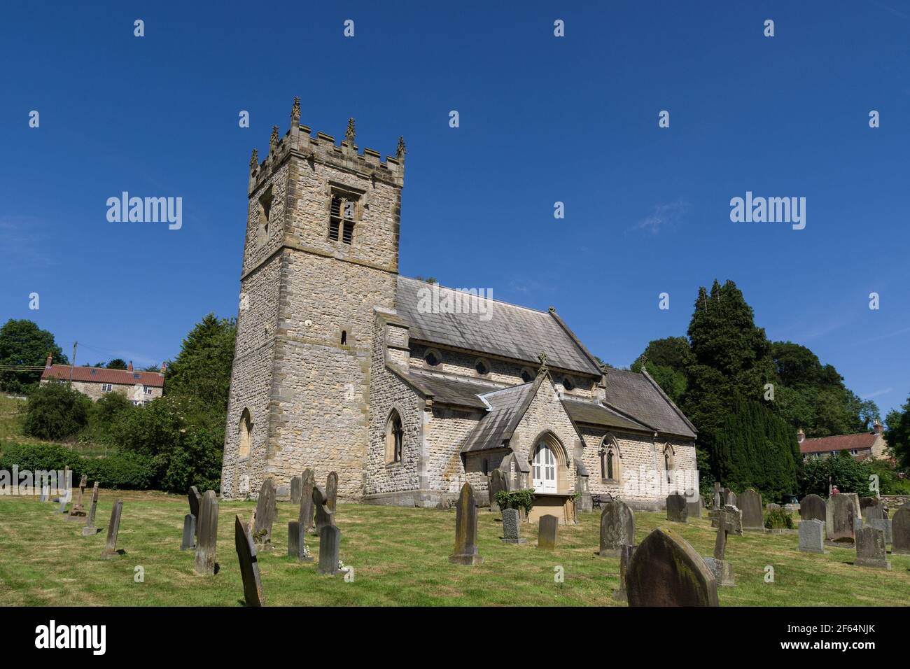 Stonegrave Minister, also known as Holy Trinity church, in Stonegrave, Yorkshire; tower is partly Anglo-Saxon with main body of church Norman Stock Photo
