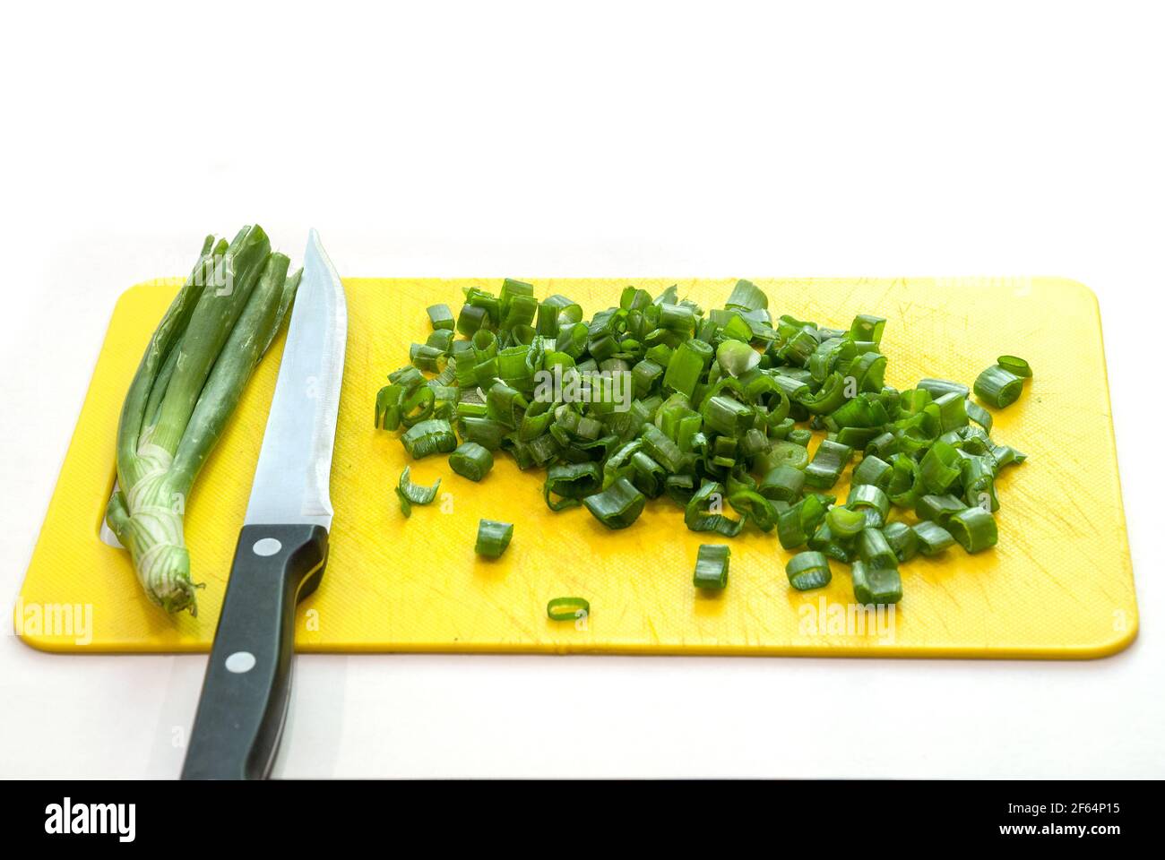 Fresh green onion on the plastic board Stock Photo - Alamy