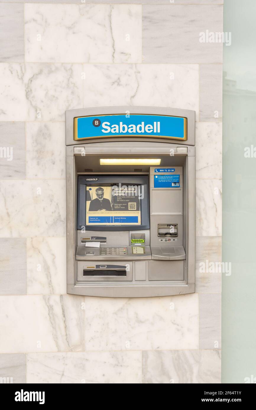 Portals Nous, Spain; march 21 2021: Close-up of an ATM of a Sabadell Bank  on the street by daylight Stock Photo - Alamy