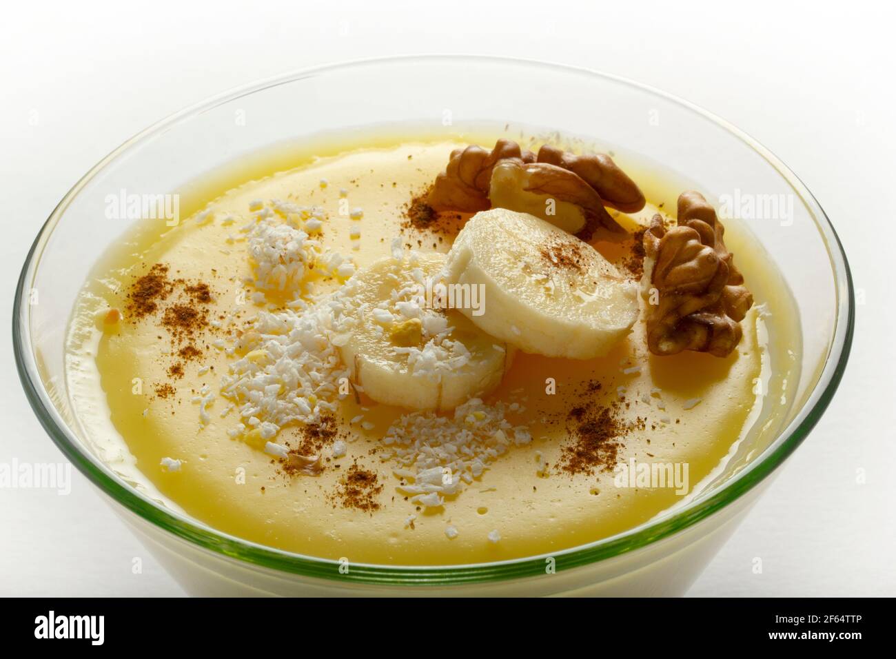 Milk and banana pudding. With coconut and cinnamon Stock Photo - Alamy