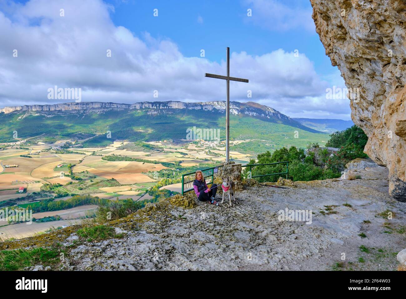 Young mature hiker woman with a dog in a viewpoint Stock Photo - Alamy