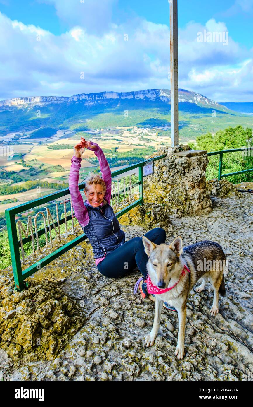 Young mature hiker woman with a dog in a viewpoint Stock Photo - Alamy