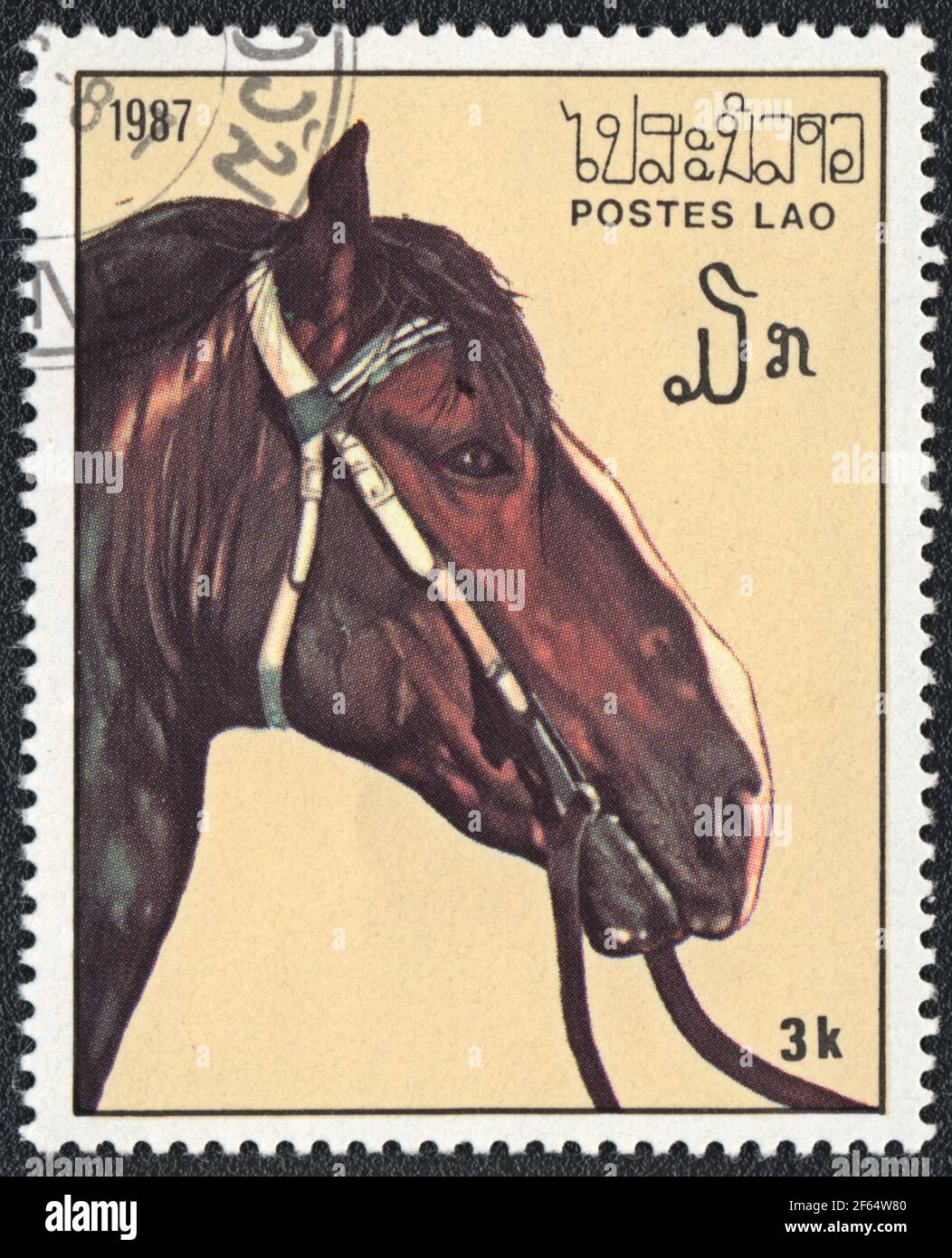 Postage stamp shows a brown harness horse (Equus ferus caballus) from series: Thoroughbred Horses, Laos, 1987 Stock Photo