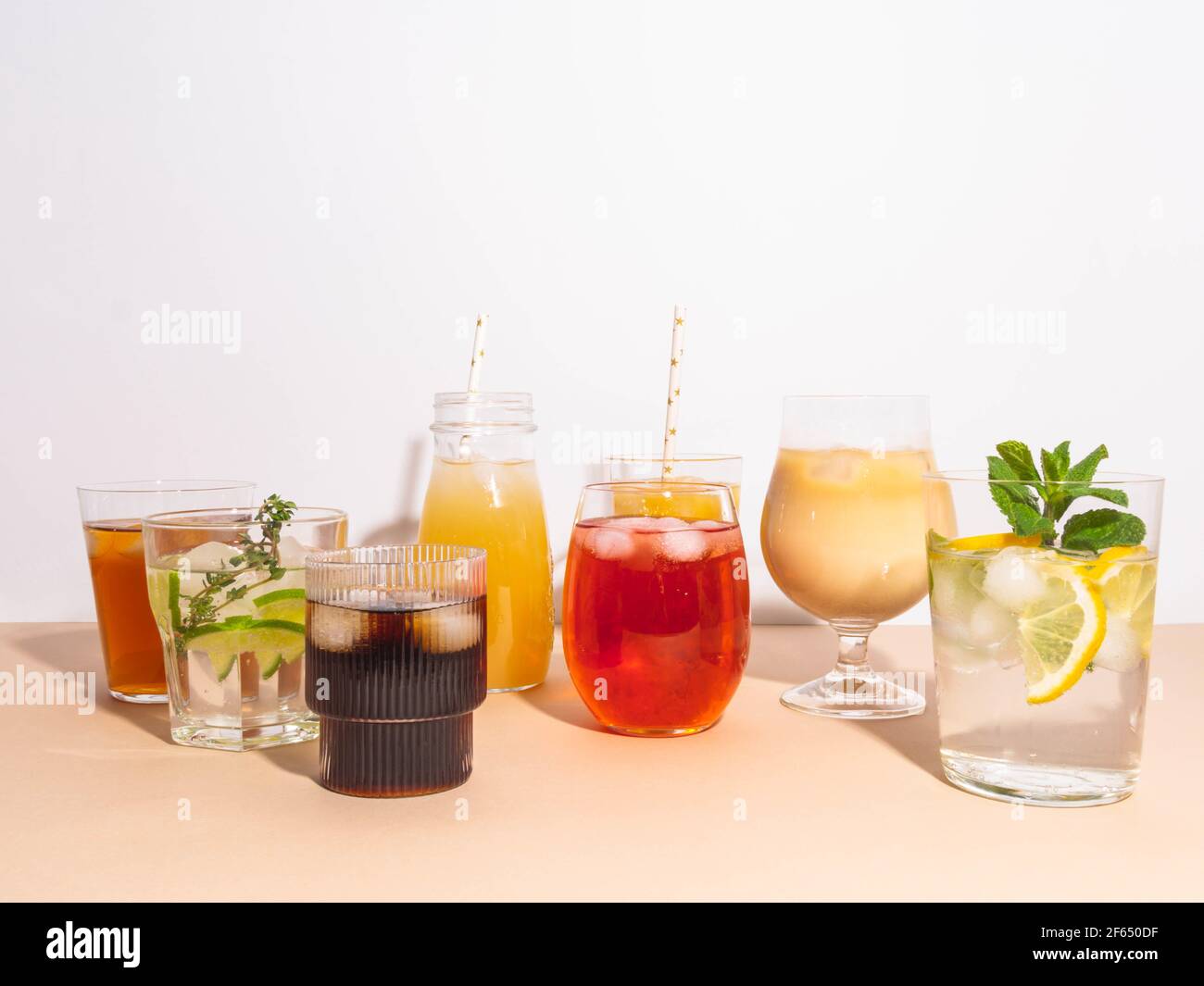 Various refreshing nonalcoholic drinks in glasses with ice. Different