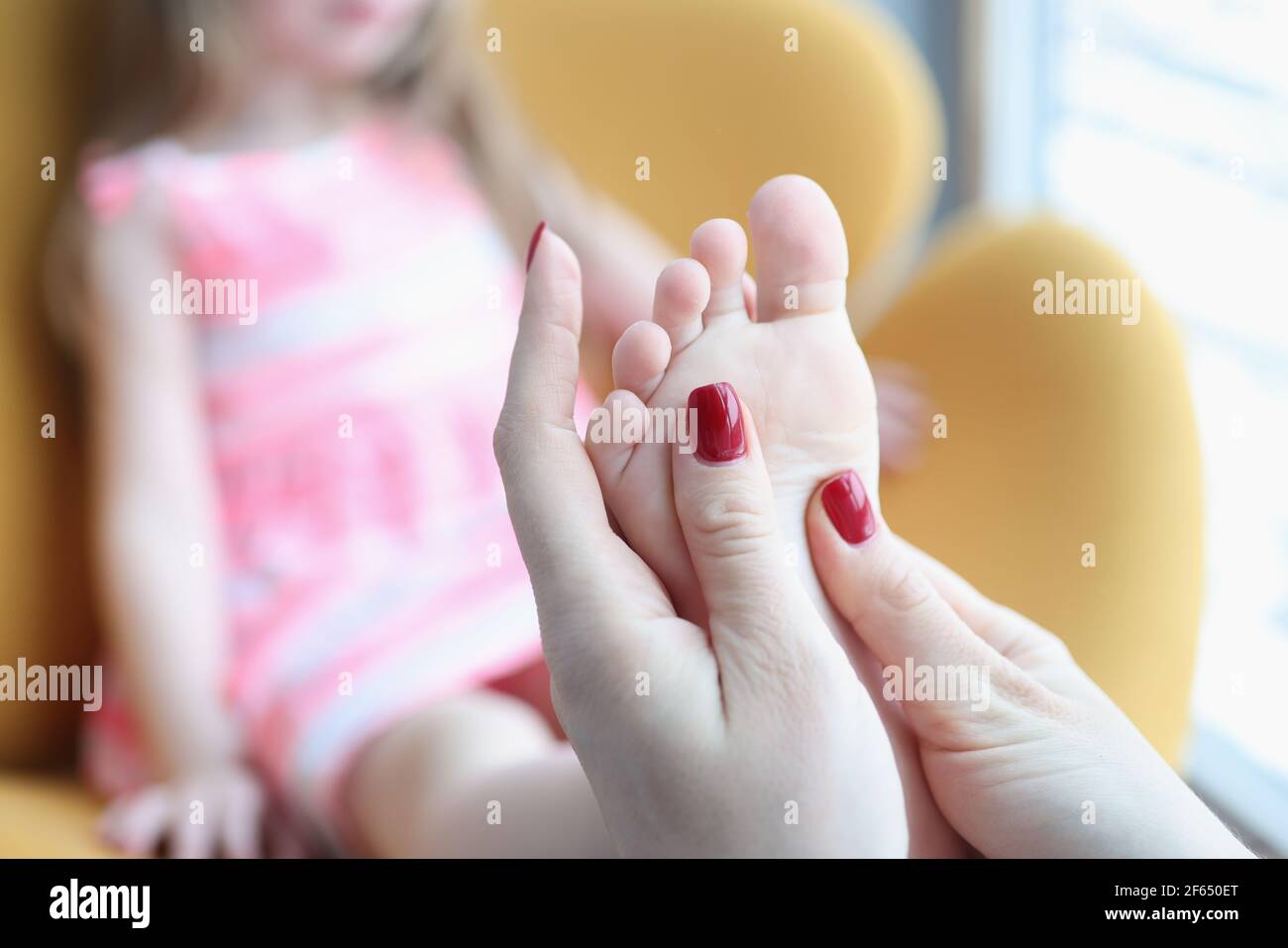 Little girl is given foot massage for flat feet Stock Photo Alamy