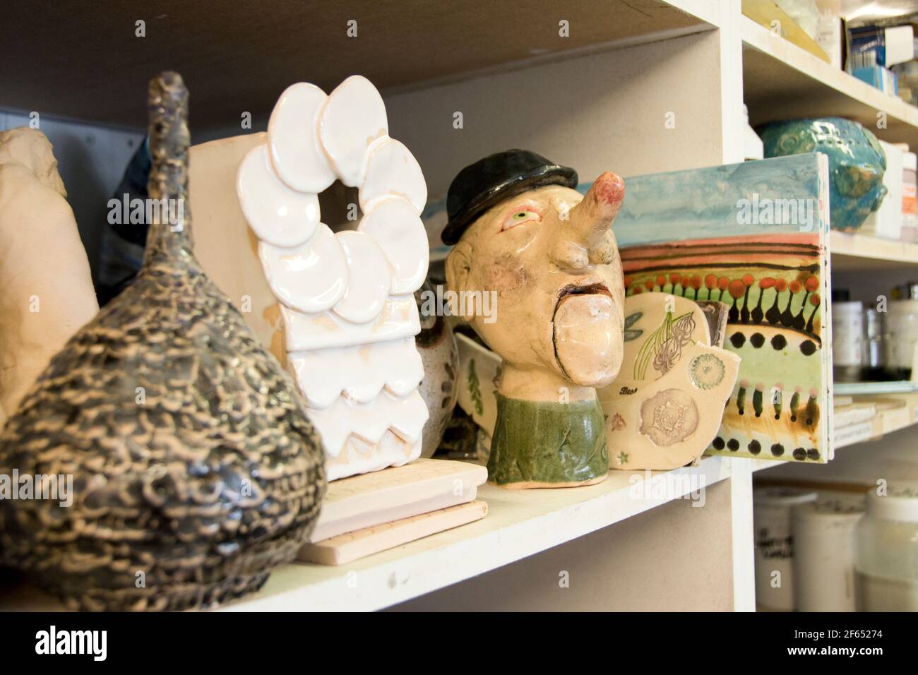 Leeds, UK- 26 July 2017 : Shelves crammed full of pottery creations at Inkwell Arts, a Leeds Mind drop in creative space at Chapel Allerton Stock Photo