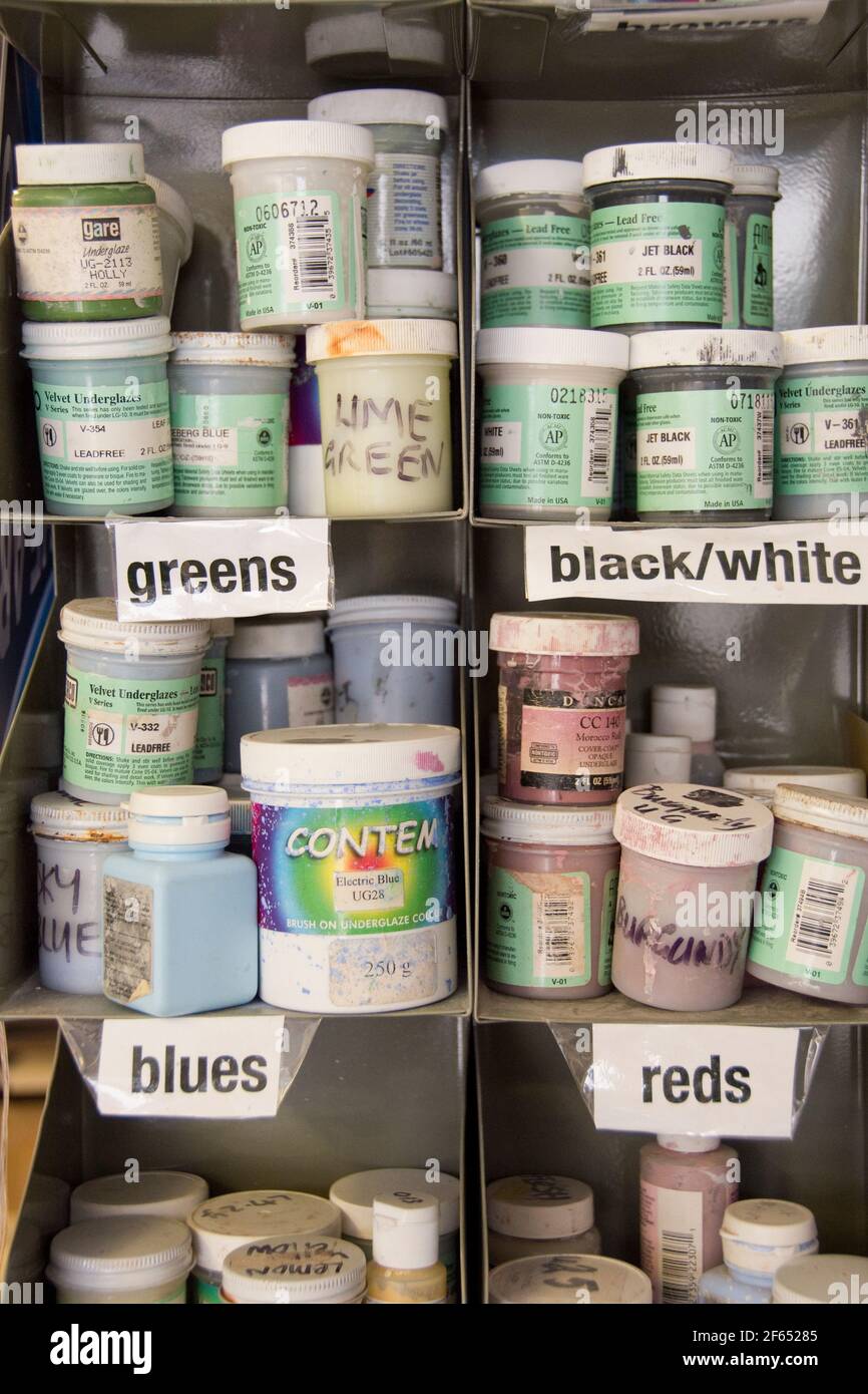 Leeds, UK- 26 July 2017 : Messy shelves crammed full of paint samples and craft supplies at Inkwell Arts, a Leeds Mind drop in creative space at Chape Stock Photo