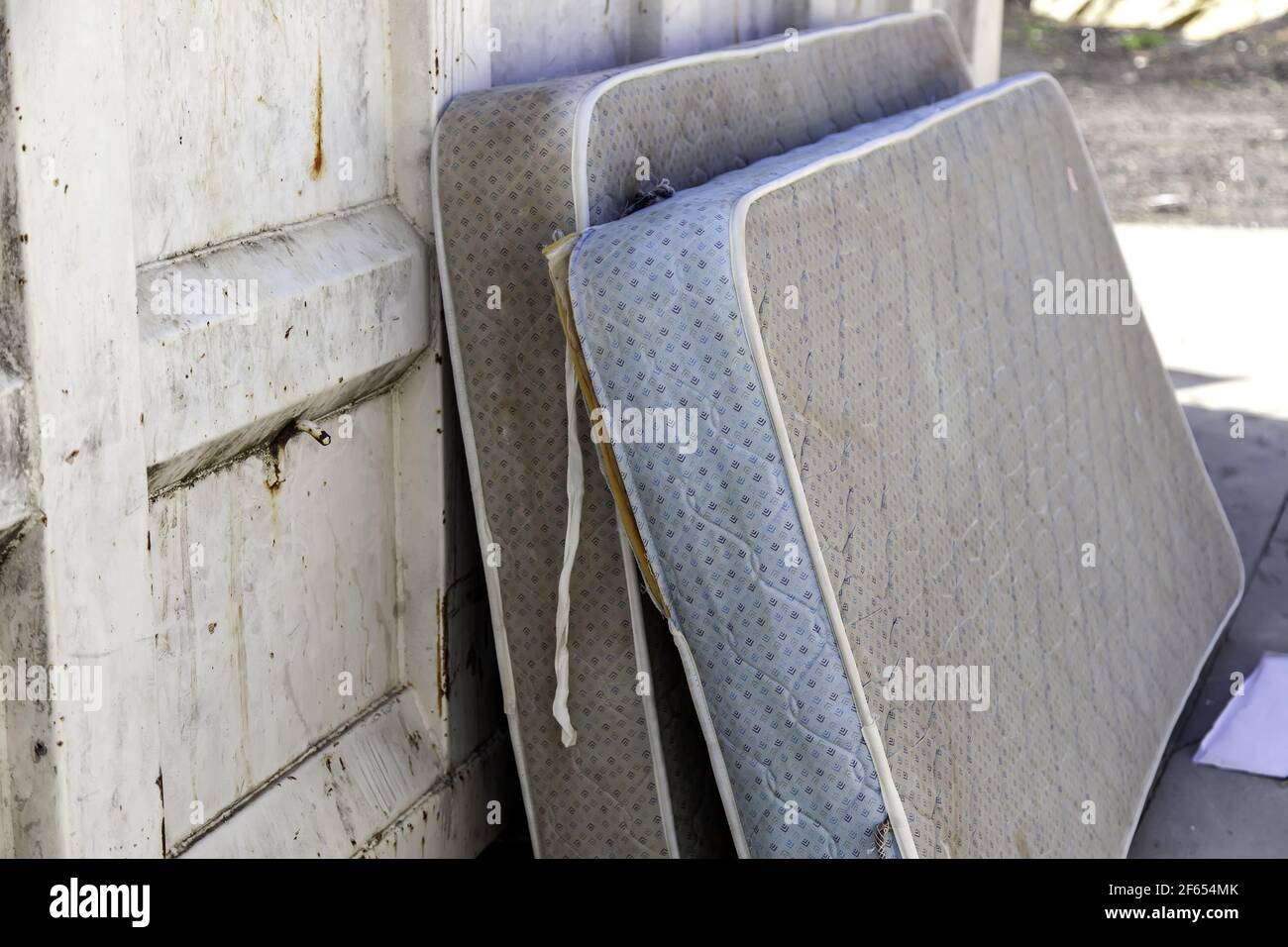Dirty container mattresses, recycling and ecology, clean point Stock Photo