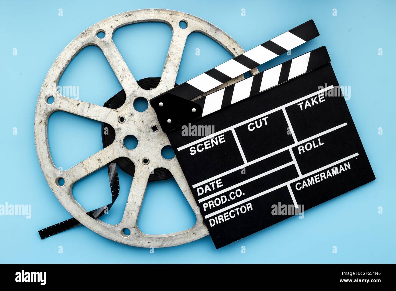 Movie film reel with clapperboard. Cinema concept Stock Photo - Alamy
