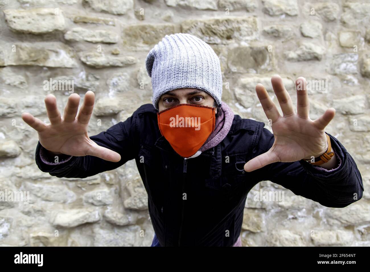 Young street gang with mask in park, social problem Stock Photo