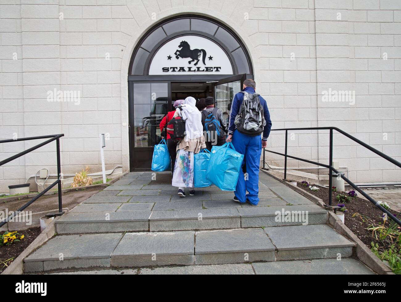 ÅTVIDABERG, SWEDEN- 6 JUNE 2014:Asylum seekers arrive at asylum accommodation, Hotell Stallet, in Åtvidaberg. Stock Photo