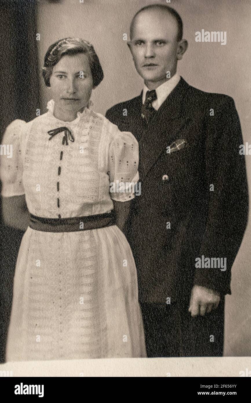 Germany - CIRCA 1930s: Shot of married couple standing in studio. Vintage Carte de Viste Edwardian era photo Stock Photo