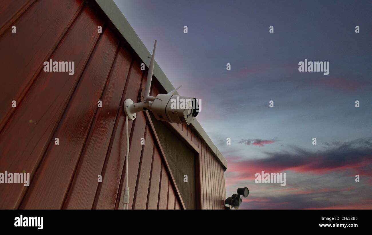 Wirelless white surveillance camera for security, CCTV concept Stock Photo