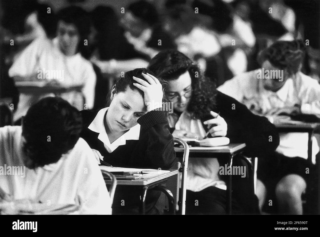 Exam Classes showing girls at Didcot School sitting their national tests Dbase - students pupils sitting in examination hall taking exam test Stock Photo