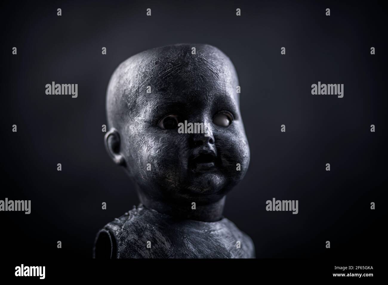Creepy doll in the dark Stock Photo