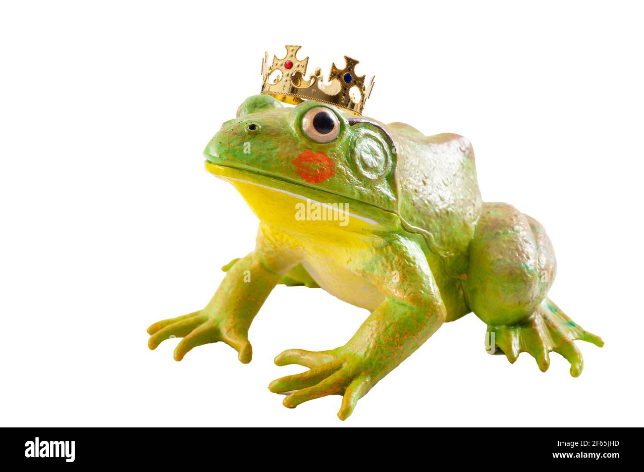 The tale of the Frog Prince and old fairytale concept with a toad wearing a king s golden crown and red lipstick marks from a kiss isolated on white b Stock Photo