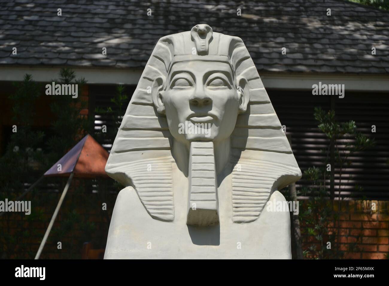 Sphinx. White concrete sphinx with white paint in the background