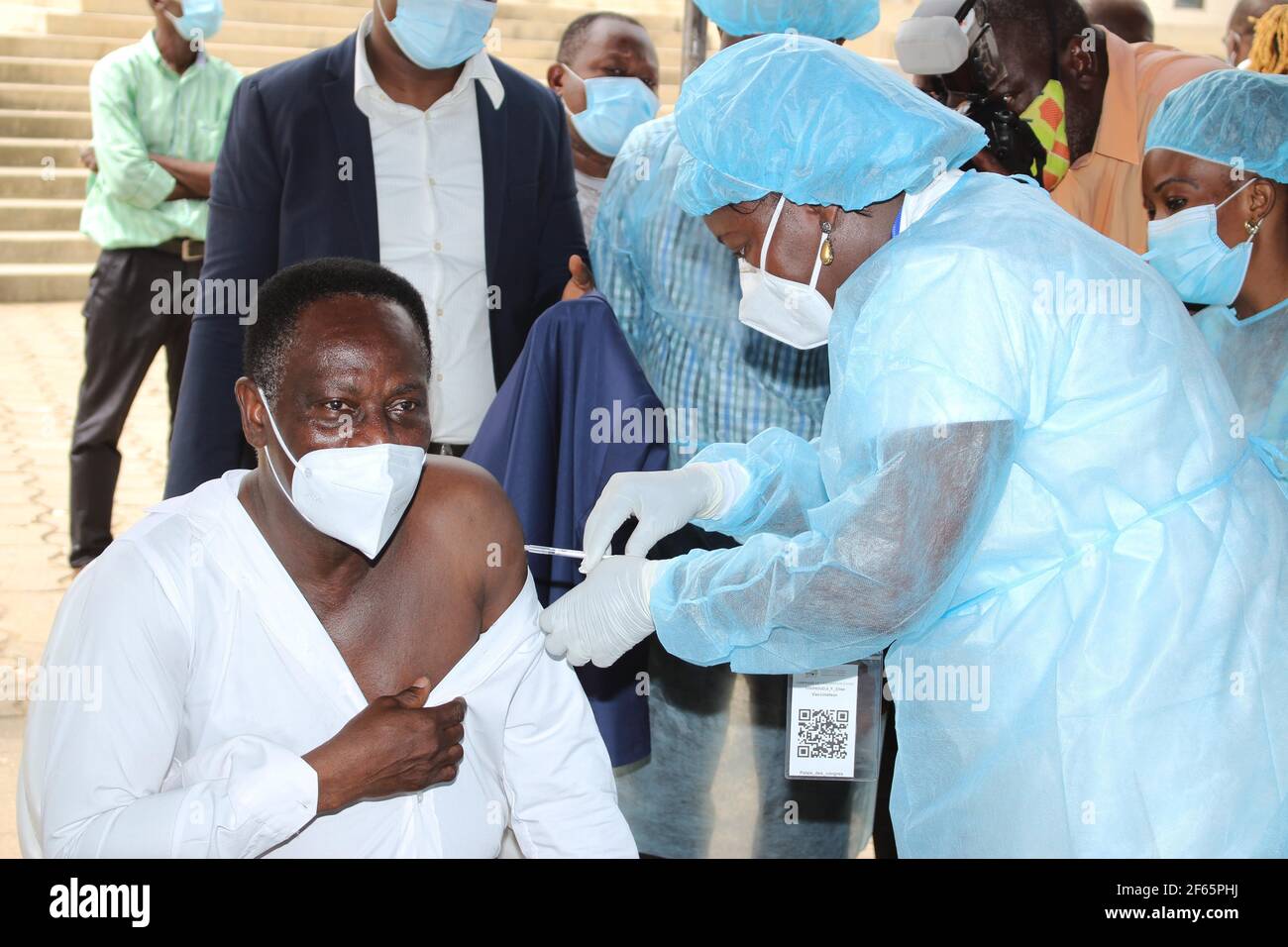 Cotonou, Benin. 29th Mar, 2021. A man receives a shot of COVID-19 vaccine at the Congress Palace of Cotonou, Benin, March 29, 2021. Benin launched on Monday the first phase of vaccination against COVID-19 that targets groups including health workers and people aged 60 and above. Credit: Seraphin Zounyekpe/Xinhua/Alamy Live News Stock Photo