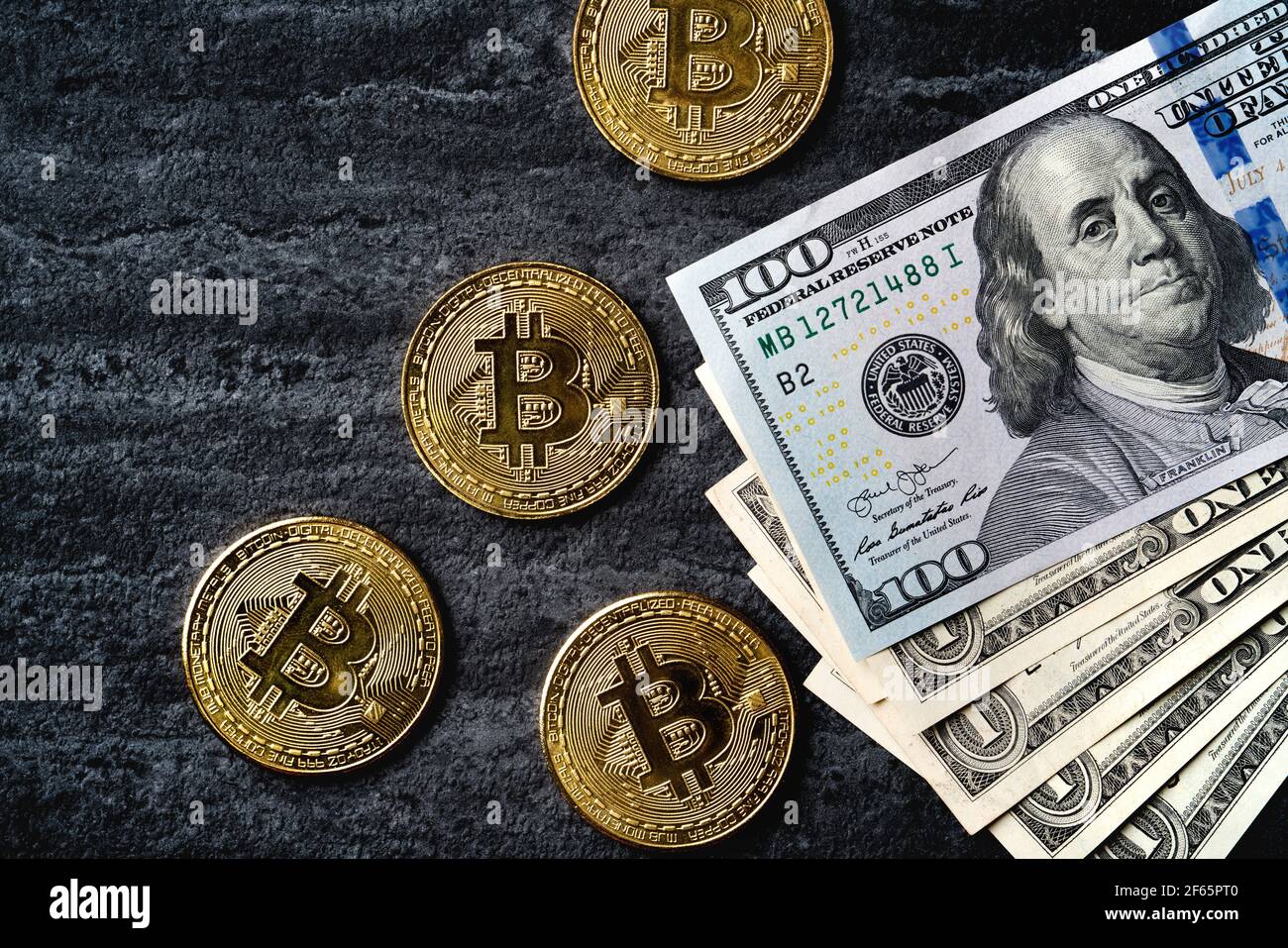 Business top view design concept of cryptocurrency bitcoin with USD Dollar  paper currency money over dark black table background Stock Photo - Alamy