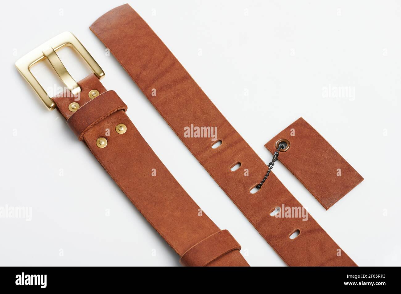 Close up of brown leather  with tag isolated on studio background Stock Photo