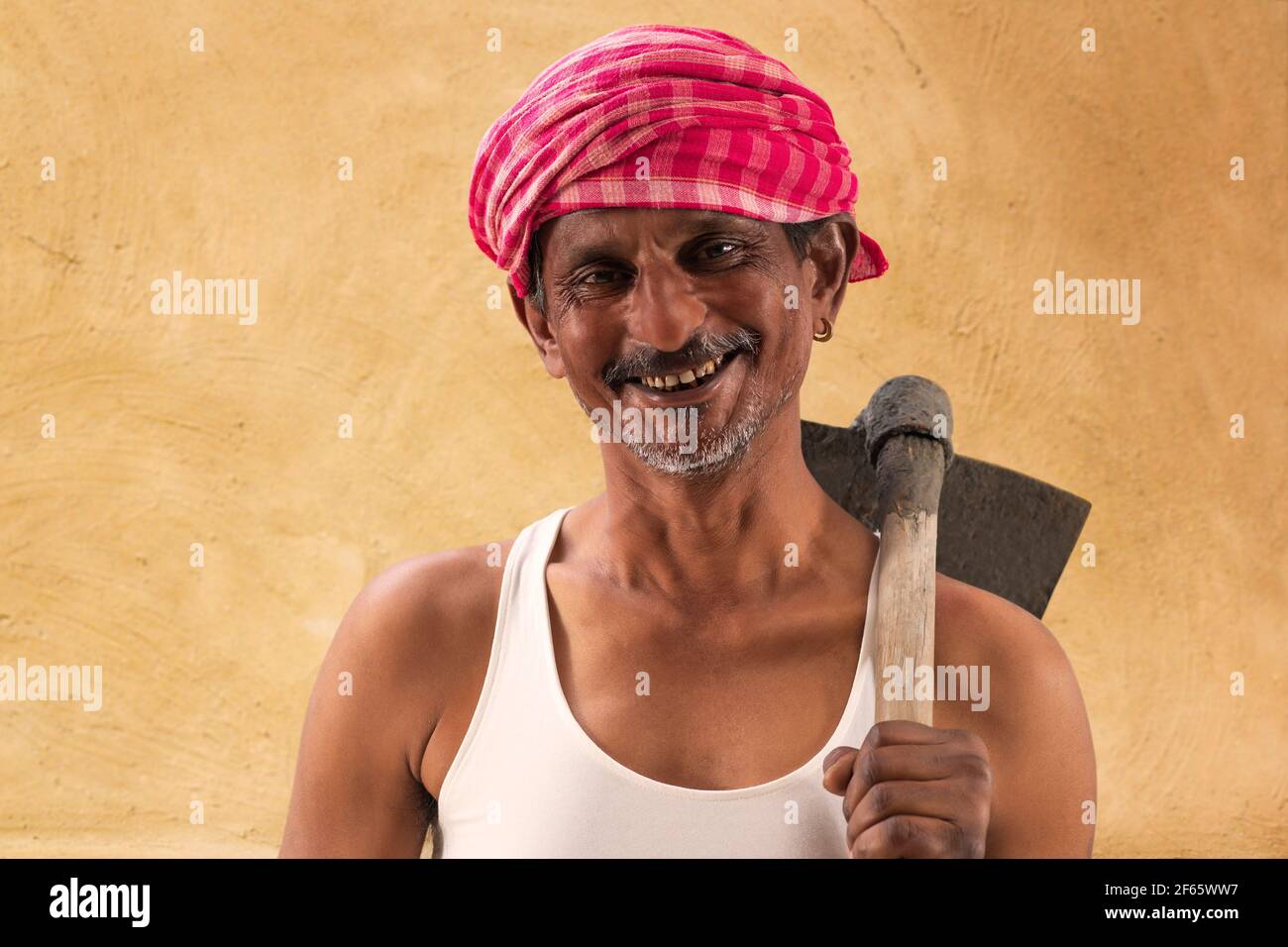 Portrait of a Farmer holding a Shovel Stock Photo - Alamy