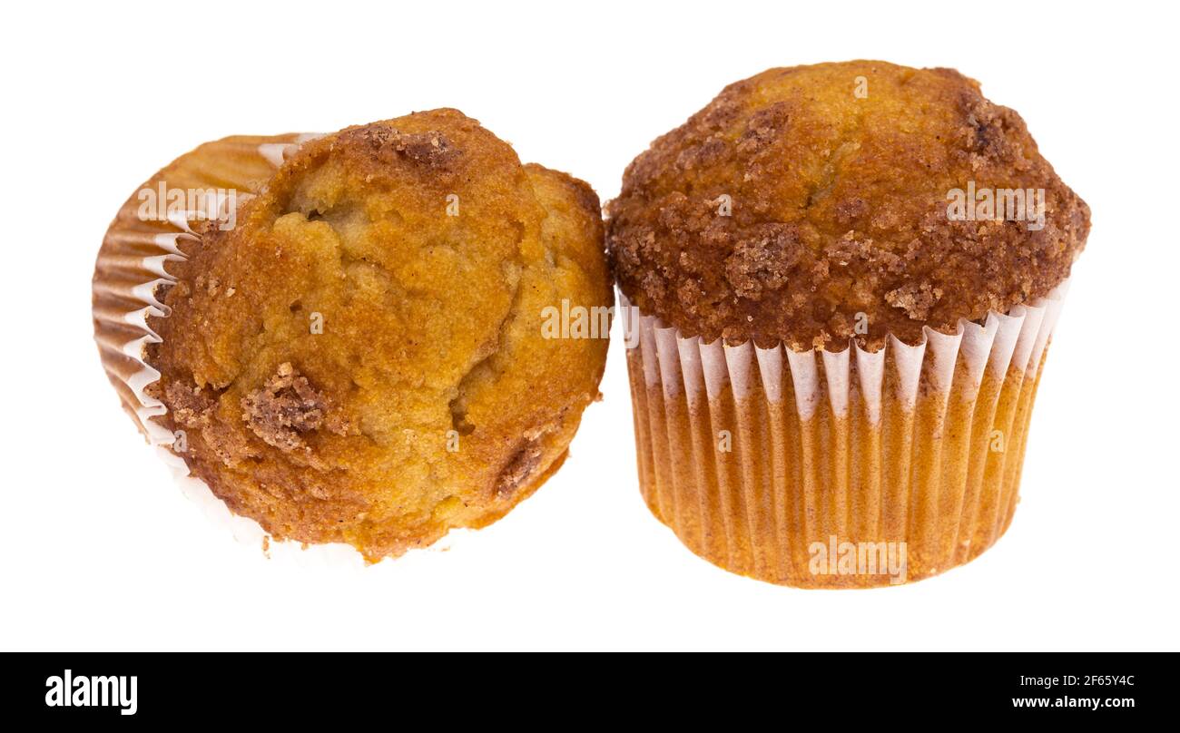Two banana Streusel muffins with one on its side and the other upright isolated on a white background. Stock Photo
