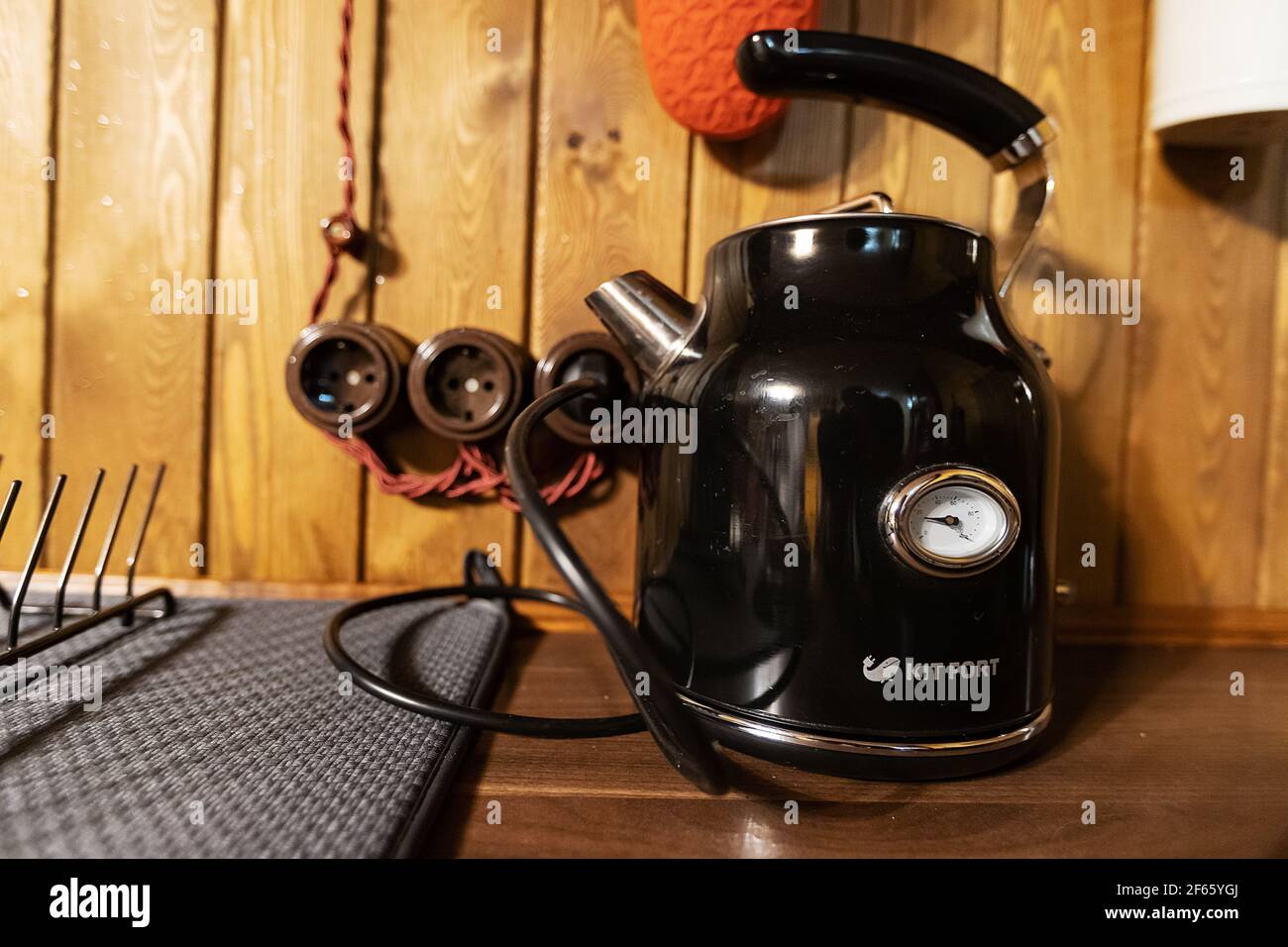 a retro electric kettle sits on the kitchen table. brew tea and boil water Stock Photo
