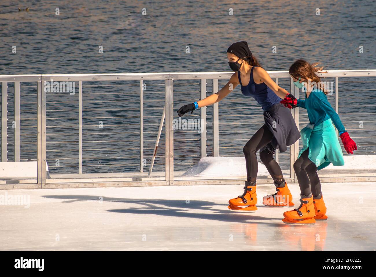 Orlando, Florida. December 22, 2020. People skating on ice rink at