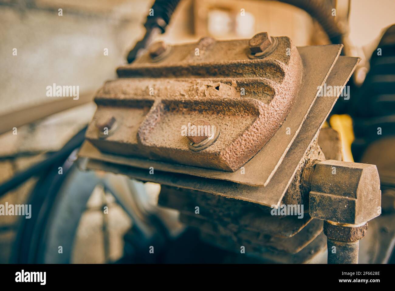 Head of Industrial Air Compressor or Air Pump and Bolt with Pipe on Center Frame in Vintage Tone Stock Photo