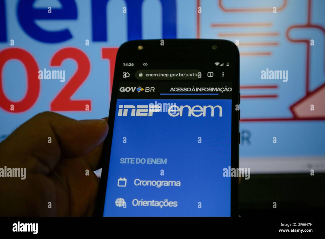 A phone shows the logos of INEP and ENEM in Sao Jose dos Campos on March 29, 2021. The National Institute for Educational Research Anísio Teixeira (Inep) will release this Monday, March 29, the result of Enem 2020 (Exame Nacional do Ensino Medio). The forecast, according to the agency, is that the grades will come out after 6 pm. (Photo: Luis Lima Jr/Fotoarena/Sipa USA) Stock Photo