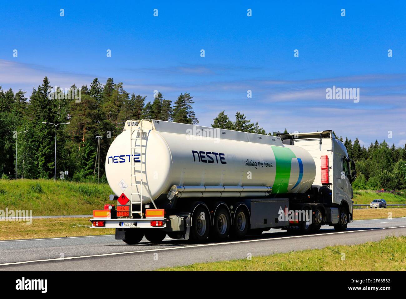 White Volvo FH semi tanker delivers NESTE diesel fuel, ADR 30-1202, on Motorway 1 on a beautiful day of summer. Salo, Finland. June 17, 2020. Stock Photo