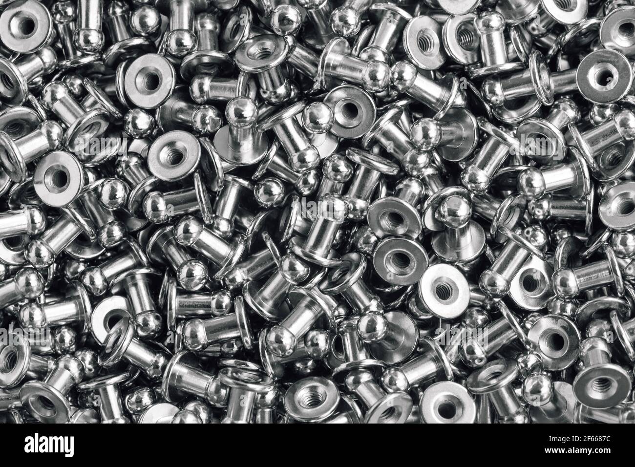 macro background of sewing accessories grommet, rivet, snap, button