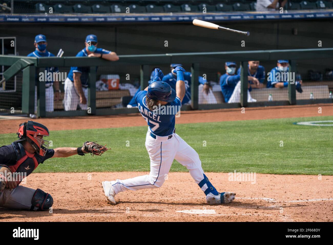 Kansas City Royals second baseman Gabriel Cancel (77) swings and loses his bat during a spring training game against the Cleveland Indians, Sunday, Ma Stock Photo