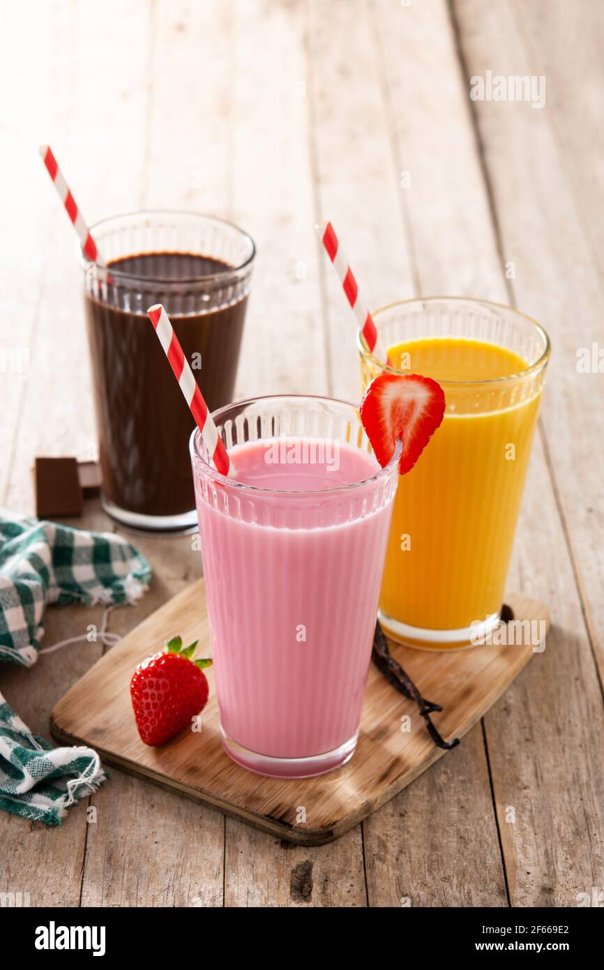 Chocolate vanilla strawberry milk shake milkshake collection straw in a cup  isolated on a white background Stock Photo - Alamy