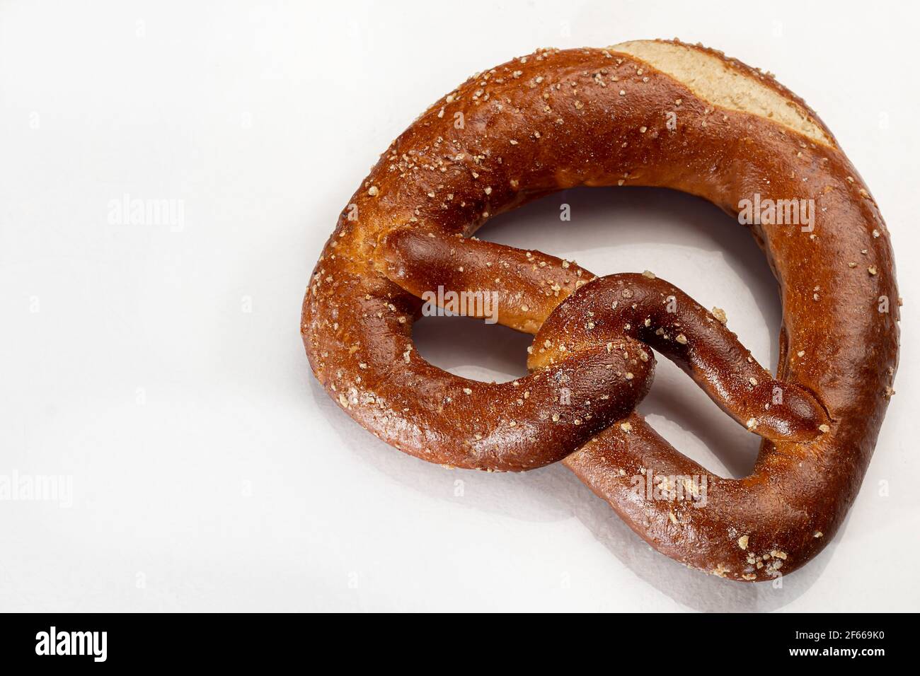 Baking pretzels on a white background. Isolate. White background. Stock Photo