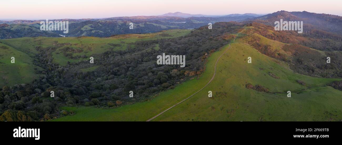 Evening sunlight illuminates the beautiful, open hills and valleys of the East Bay, just east of San Francisco Bay in northern California. Stock Photo