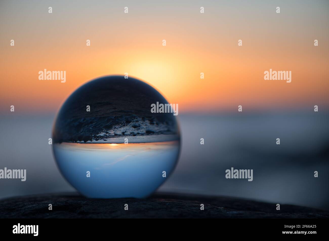 Sunset through a crystal ball Stock Photo - Alamy