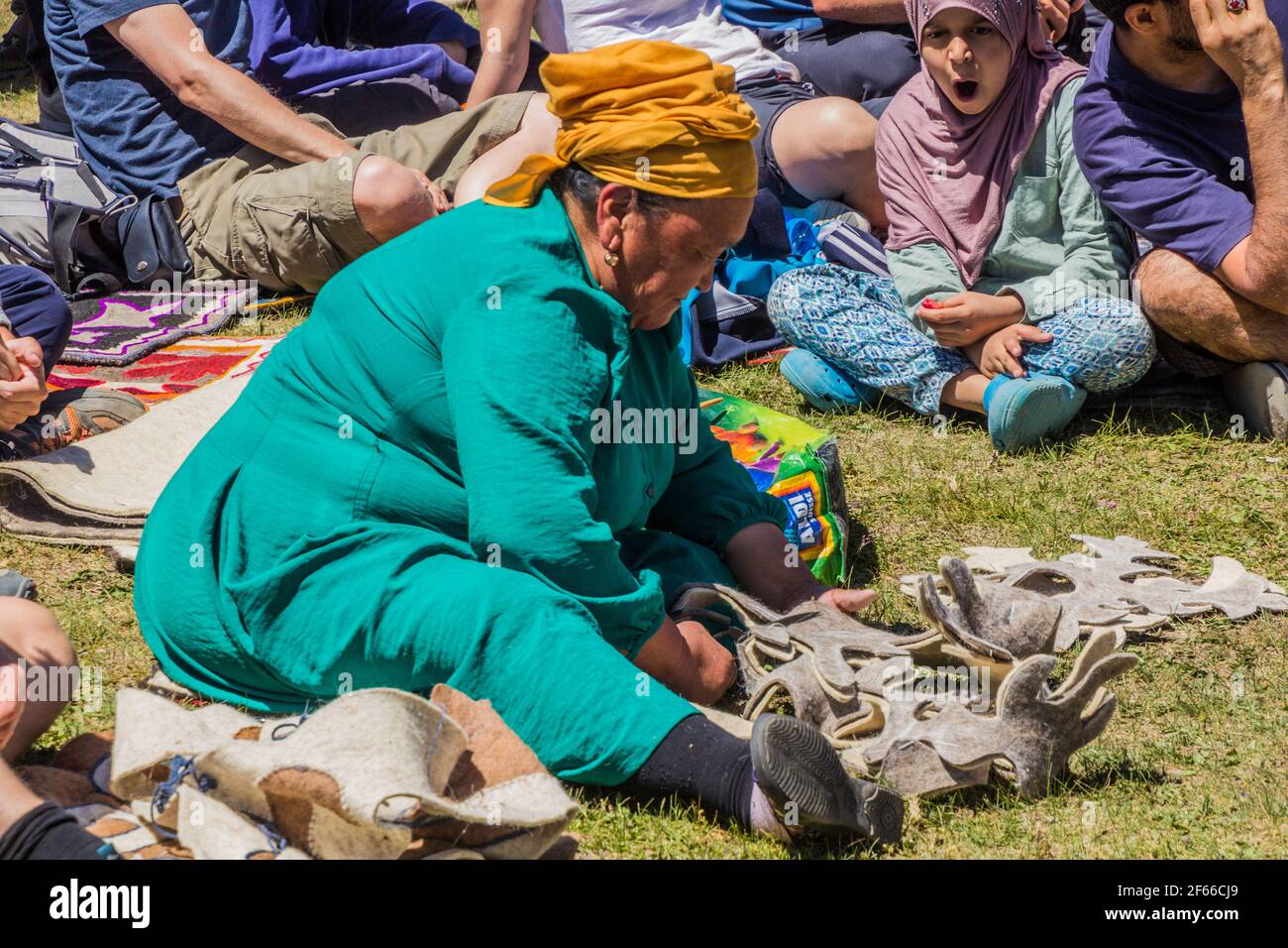 SONG KOL, KYRGYZSTAN - JULY 25, 2018: Traditional Kyrgyz felt carpet making at the National Horse Games Festival at the shores of Son Kol Lake Stock Photo